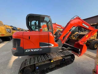 Used Doosan DX60-9C hydraulic mini excavator, suitable for small industrial projects. High quality, available for sale.