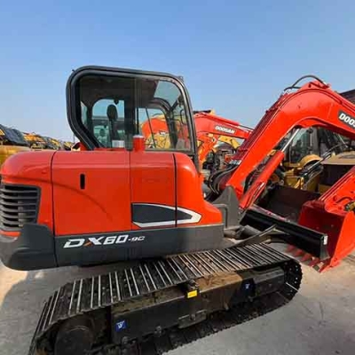 Used Doosan DX60-9C hydraulic mini excavator, suitable for small industrial projects. High quality, available for sale.
